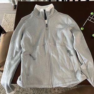 Light grey north face zip up with fleece lining